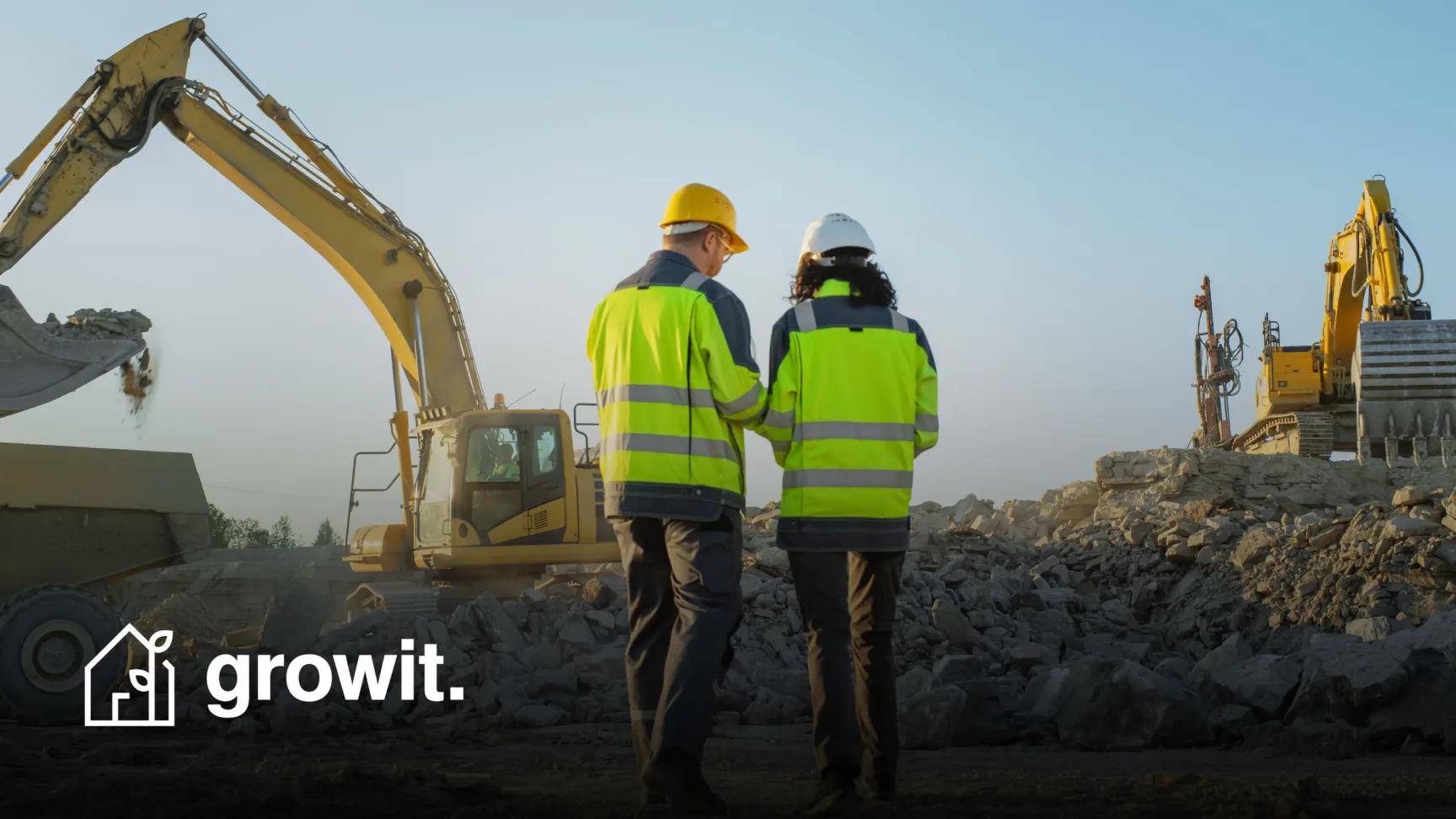 Two construction workers in high-visibility jackets survey an excavation site, with the GrowIt logo