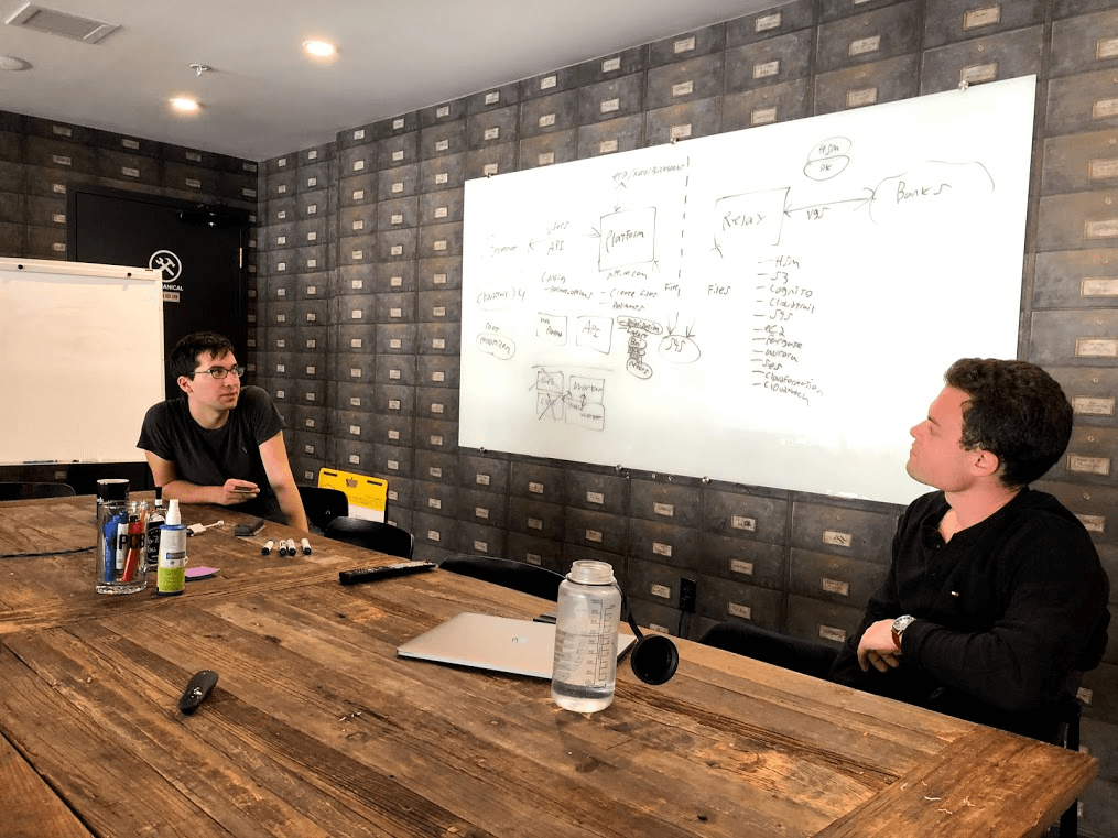 Matt and Sam brainstorming application architecture.